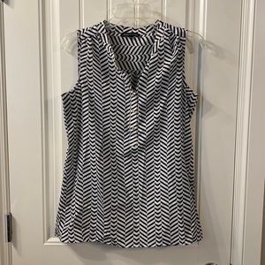 Black and white striped collarless,  sleeveless shirt